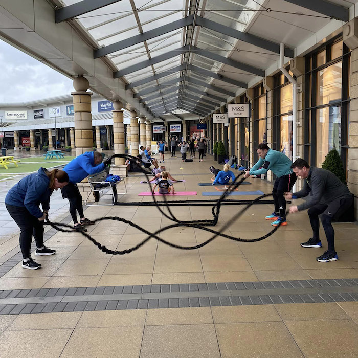 Group of people taking part in outdoors fitness class at Lakeside Village